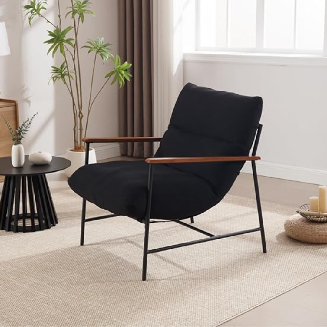 accent chair with metal frame and deep cushioned seat, black cushions in a modern living room.
