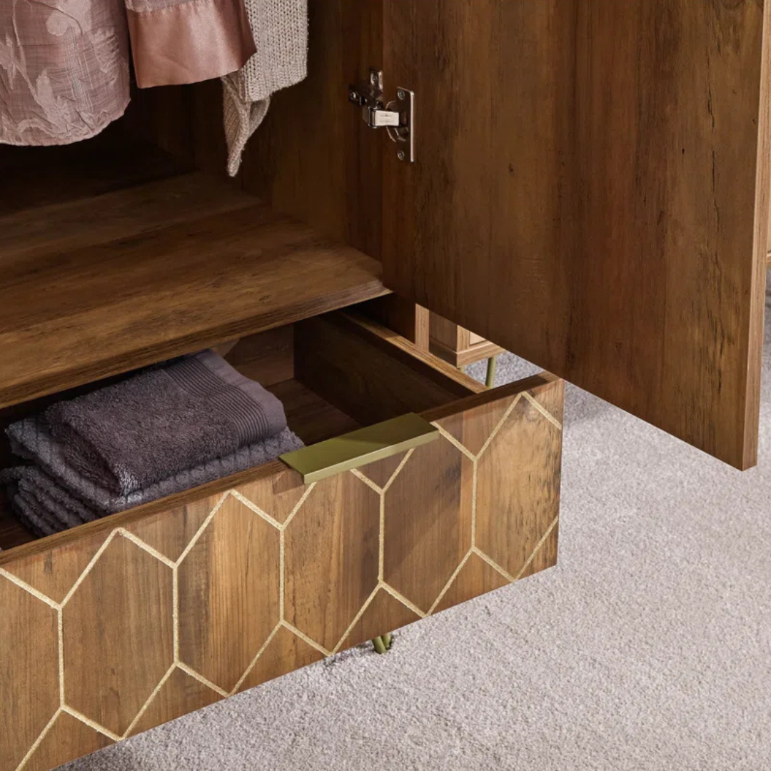 Wooden cabinet with geometric patterned drawer open, revealing folded towels inside.