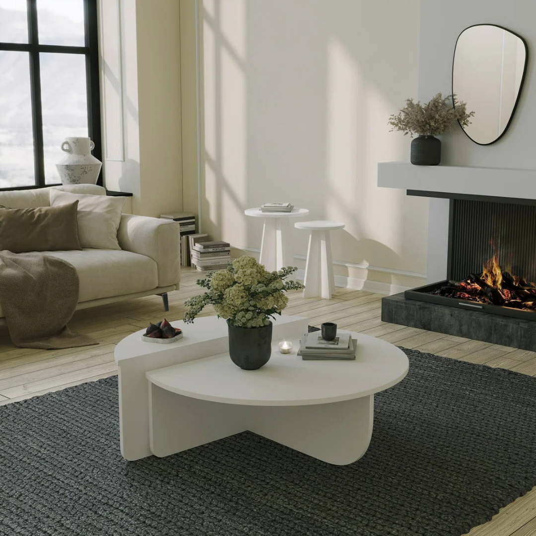Contemporary low round coffee table with magazine slot, white table set in a modern home.