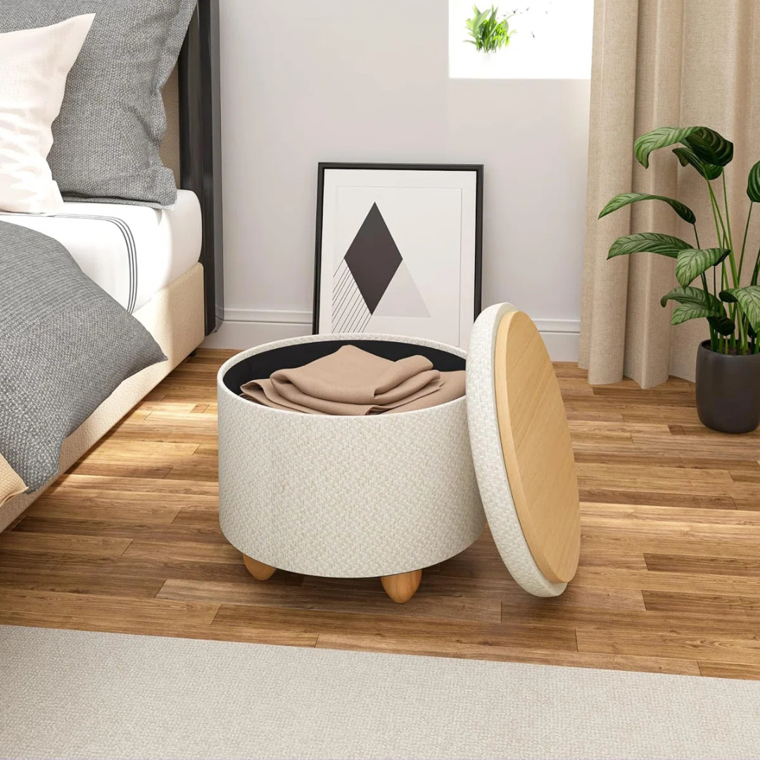 Contemporary Round Ottomans With Storage, cream set in a model bedroom.