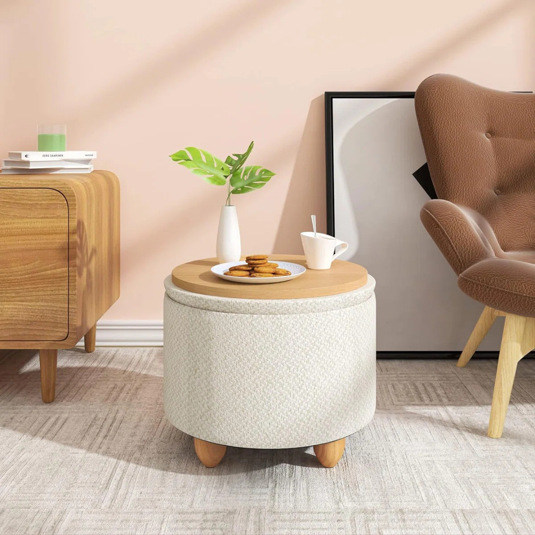 Contemporary Round Ottomans With Storage, cream set in a model home.