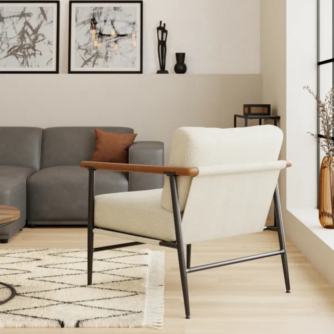 modern white boucle accent chair with wood arms and metal frame, back view.
