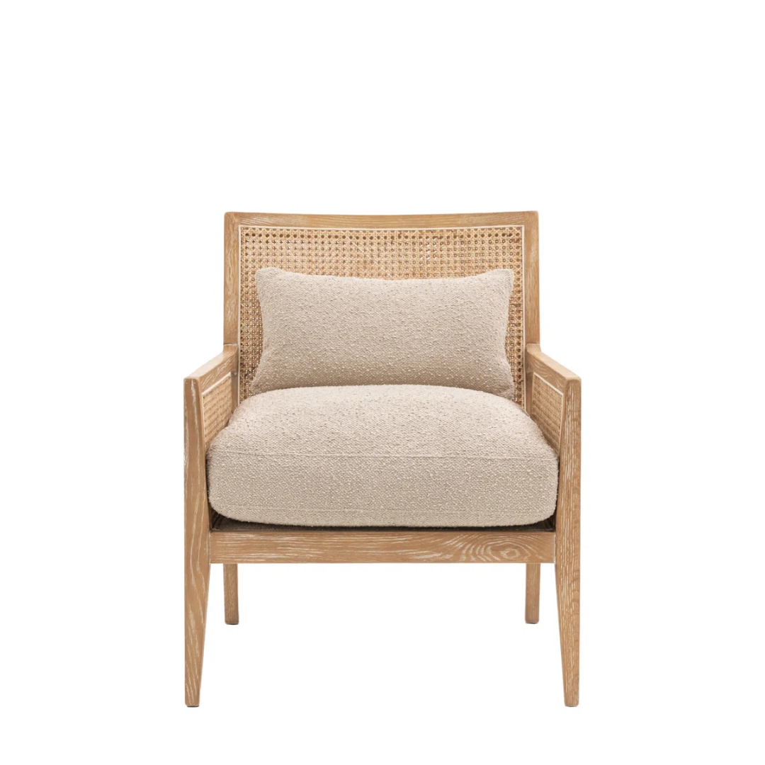 Beige armchair with woven backrest on a white background