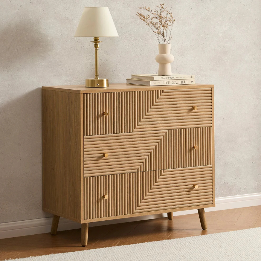 Geometric Mid Century Modern Drawers Chest, Wooden dresser with geometric design, lamp, and books against a neutral wall.