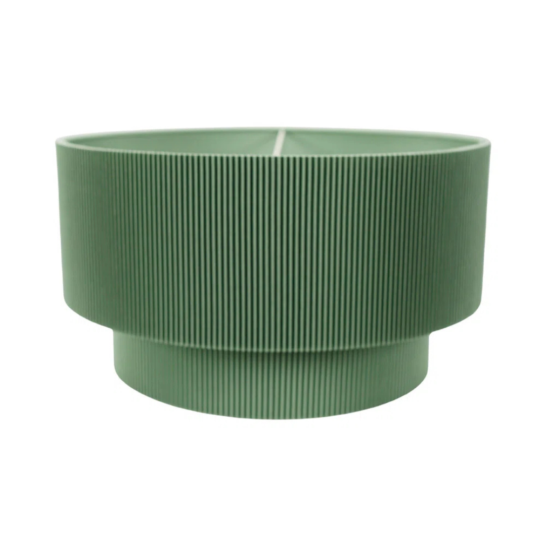 Green ribbed planter on a white background