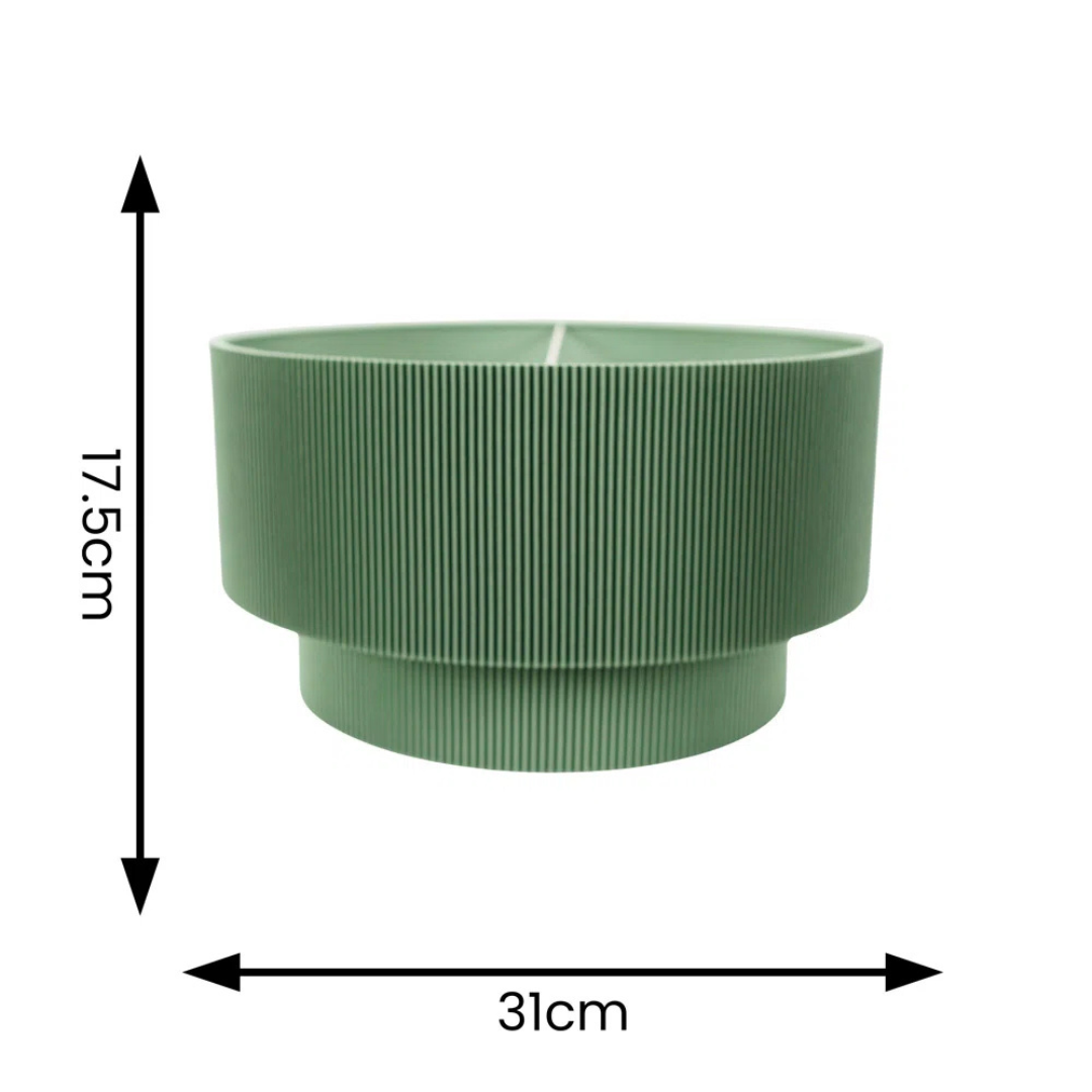Green ribbed planter with dimensions on a white background