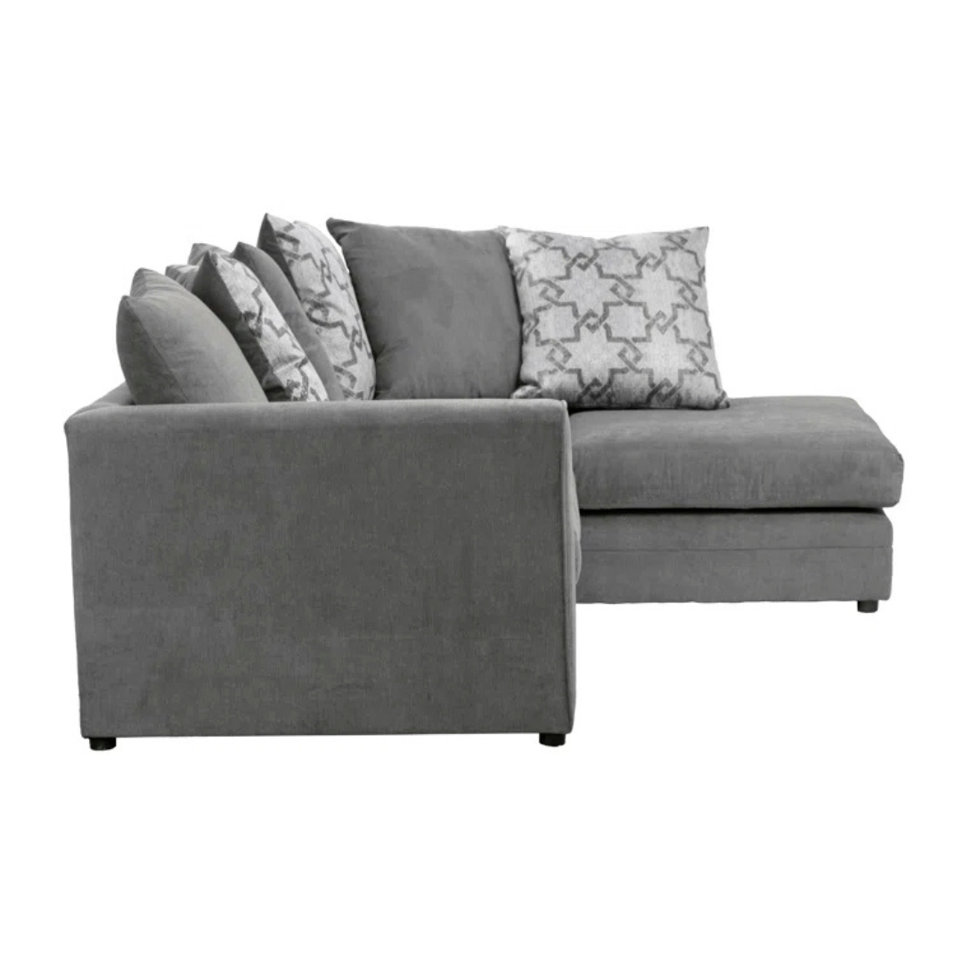 Grey Modern Corner Sofa With Pillows, white background, side view.