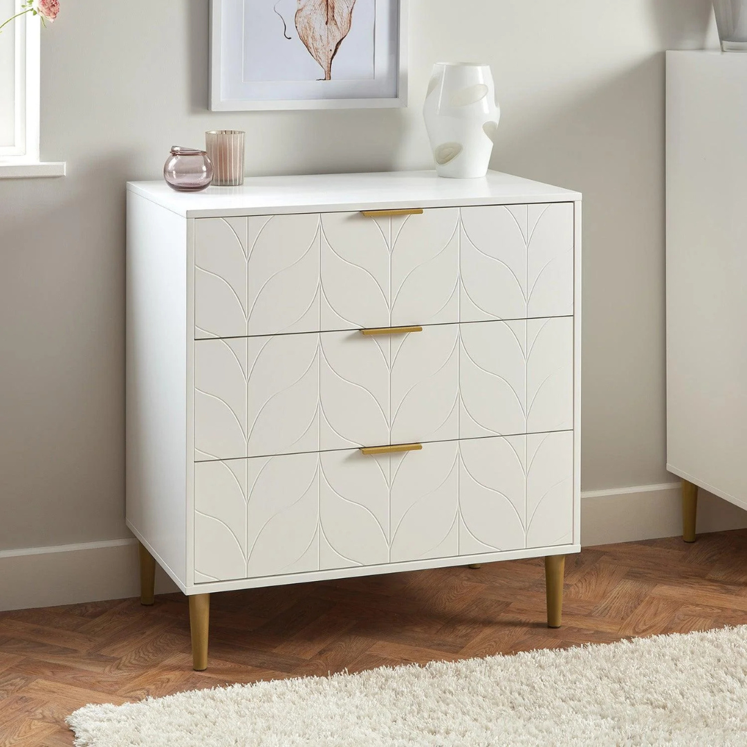 Leaf Design 3 Drawer Chest Of Drawers White, set in a modern home, angled, view.