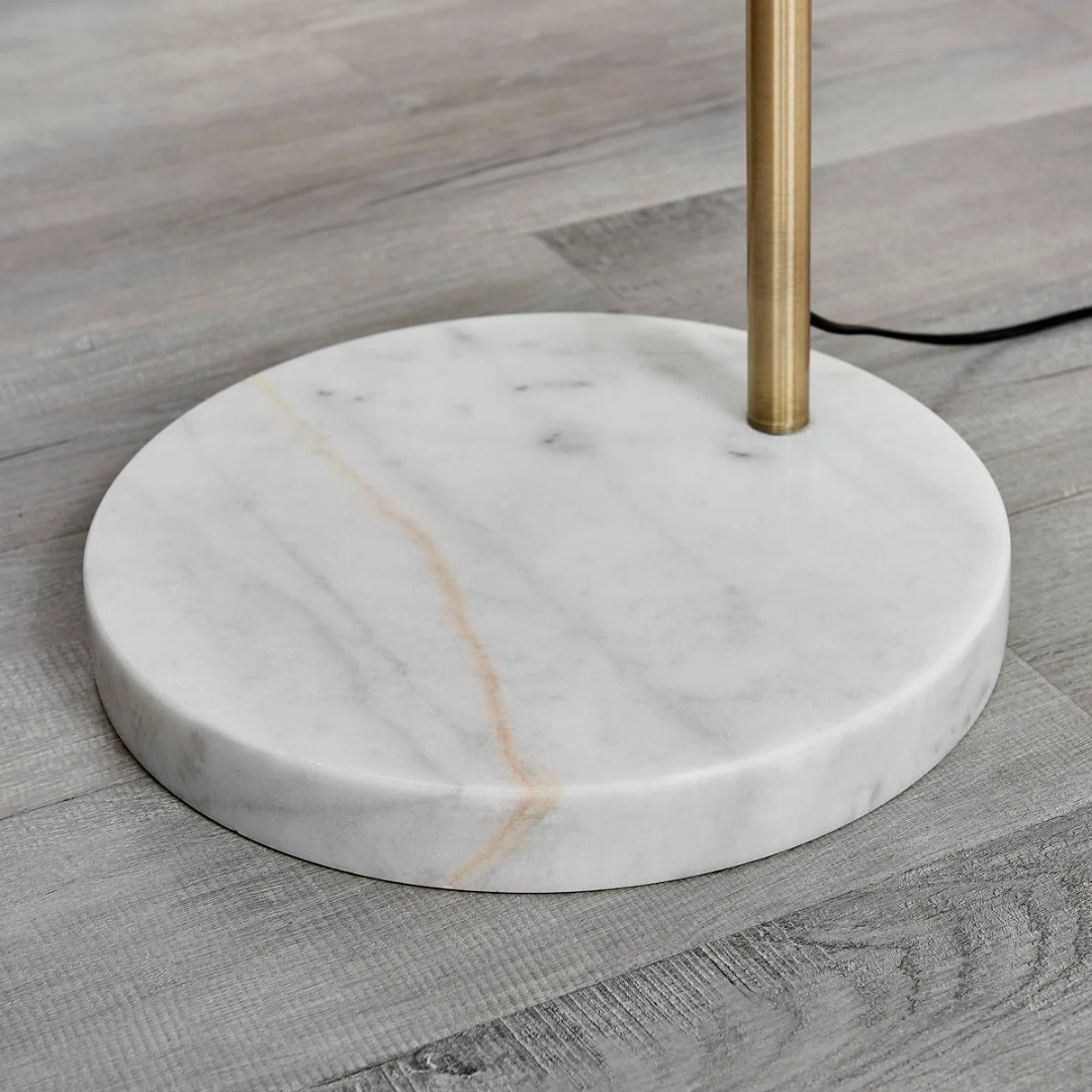 Floor lamp with marble base on a wooden floor