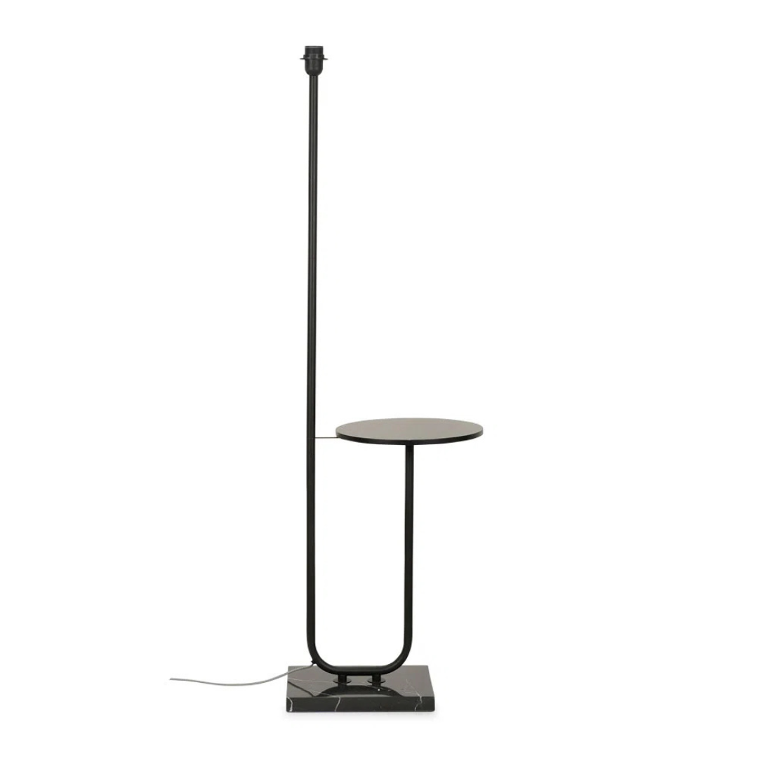Black floor lamp with a small round table on a white background