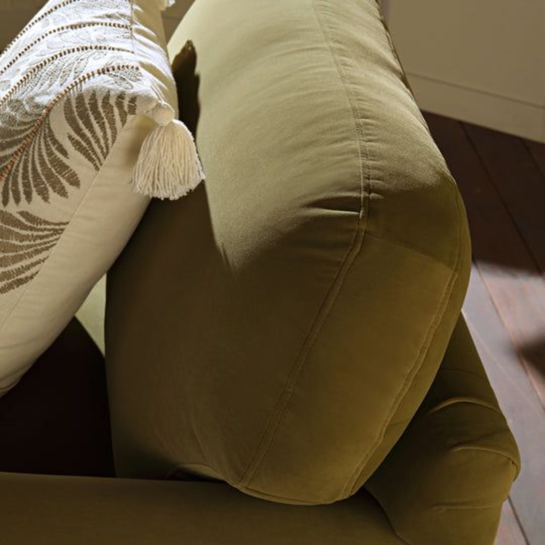 Mid Century Modern Olive Green Armchair close up of the soft backrest