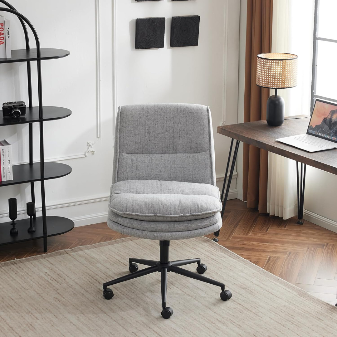 modern ergonomic armless office chair with cushioned seat, grey office chair, front view, in a modern office.