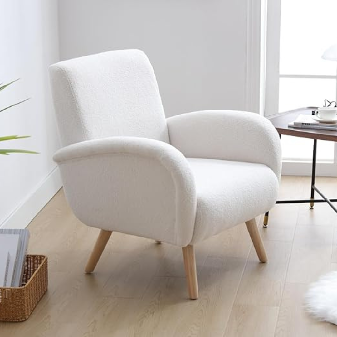 modern faux fur armchair with high back and rounded arms, set in a reading corner.