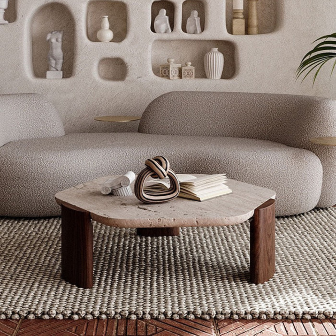 modern marble luxury coffee table with sculpted wood legs, in a modern living room.