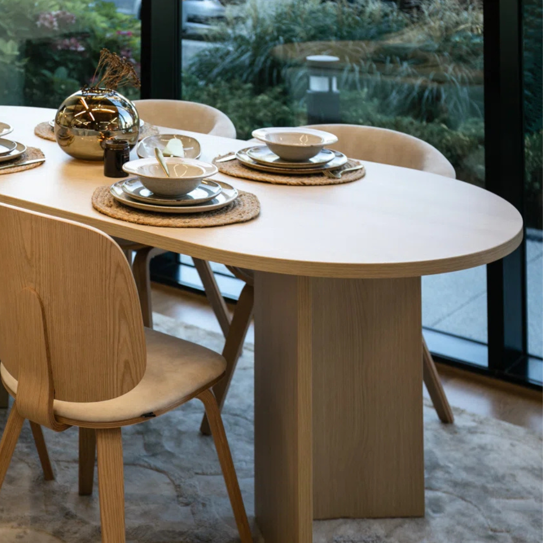 Modern Oval Wooden Dining Table, close up in a modern home.