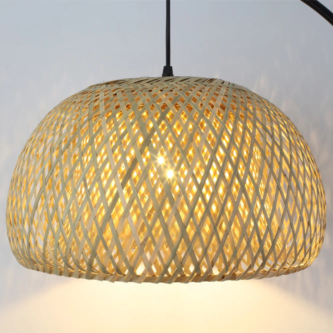 Woven pendant light with a warm glow on a neutral background