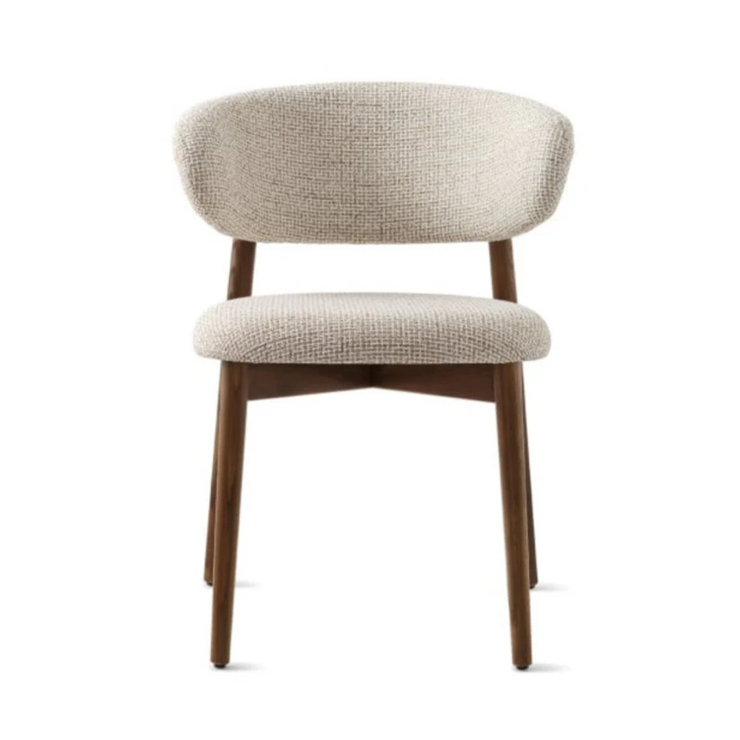 dining chair with soft upholstered seat and clean frame, white background, front view.