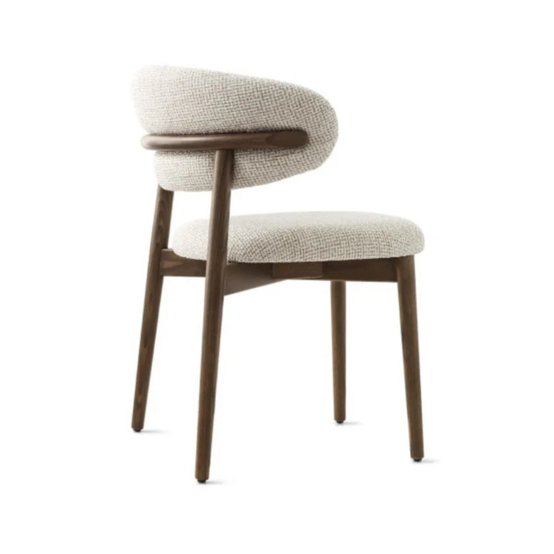 dining chair with soft upholstered seat and clean frame, white background, side view.