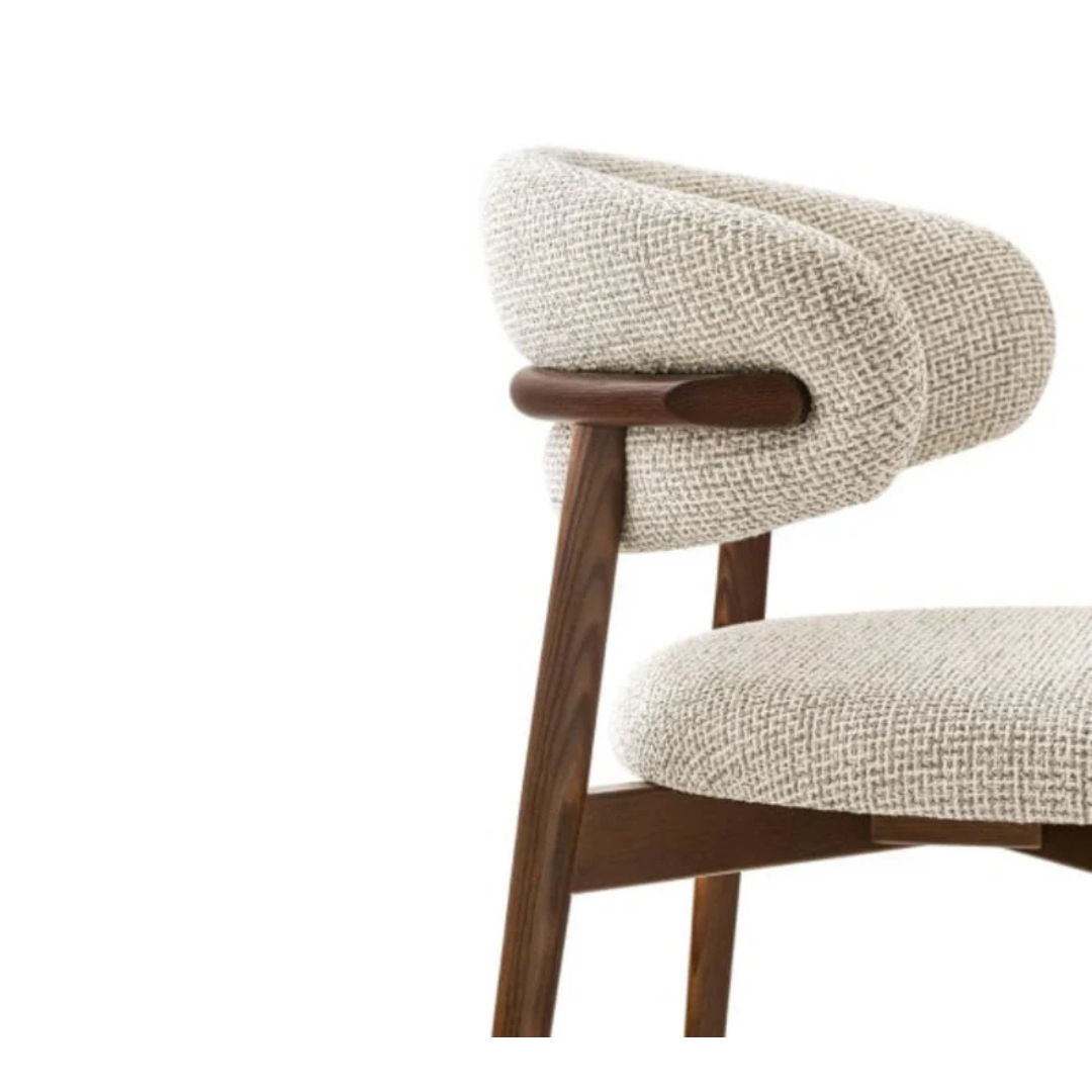 dining chair with soft upholstered seat and clean frame, close up to the fabric design