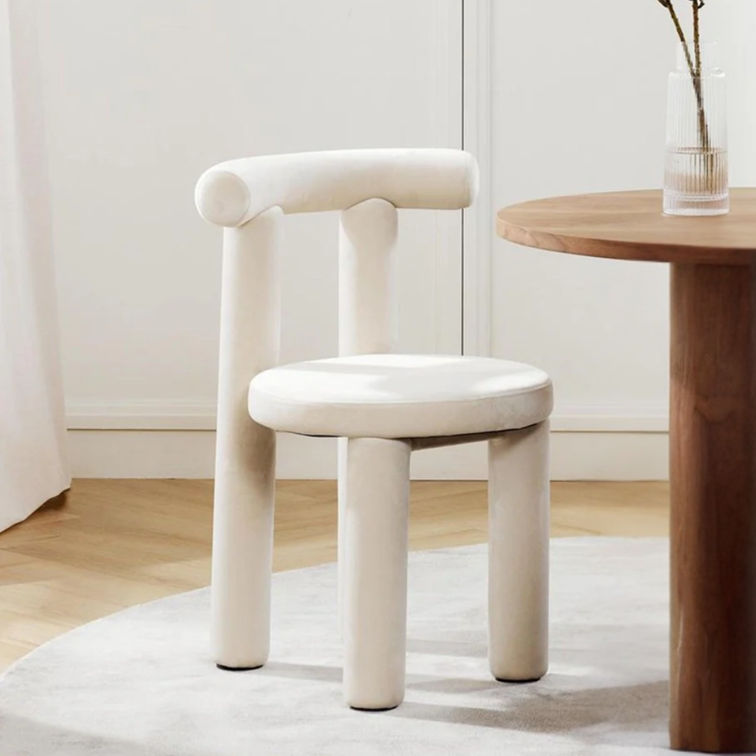 Modern White Boucle Dining Chair styled in a cosy dining room