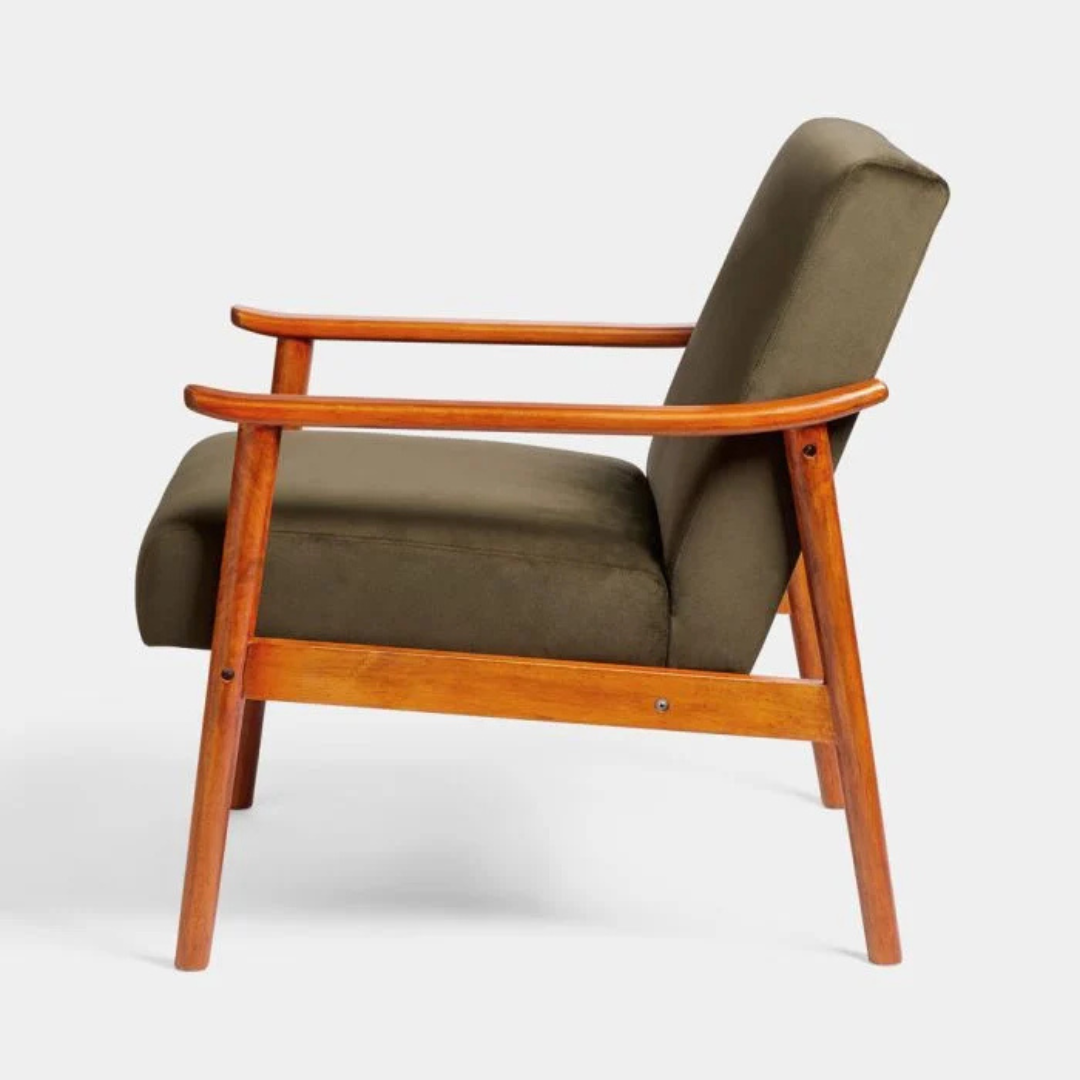 A olive green velvet chair, white background, side view.