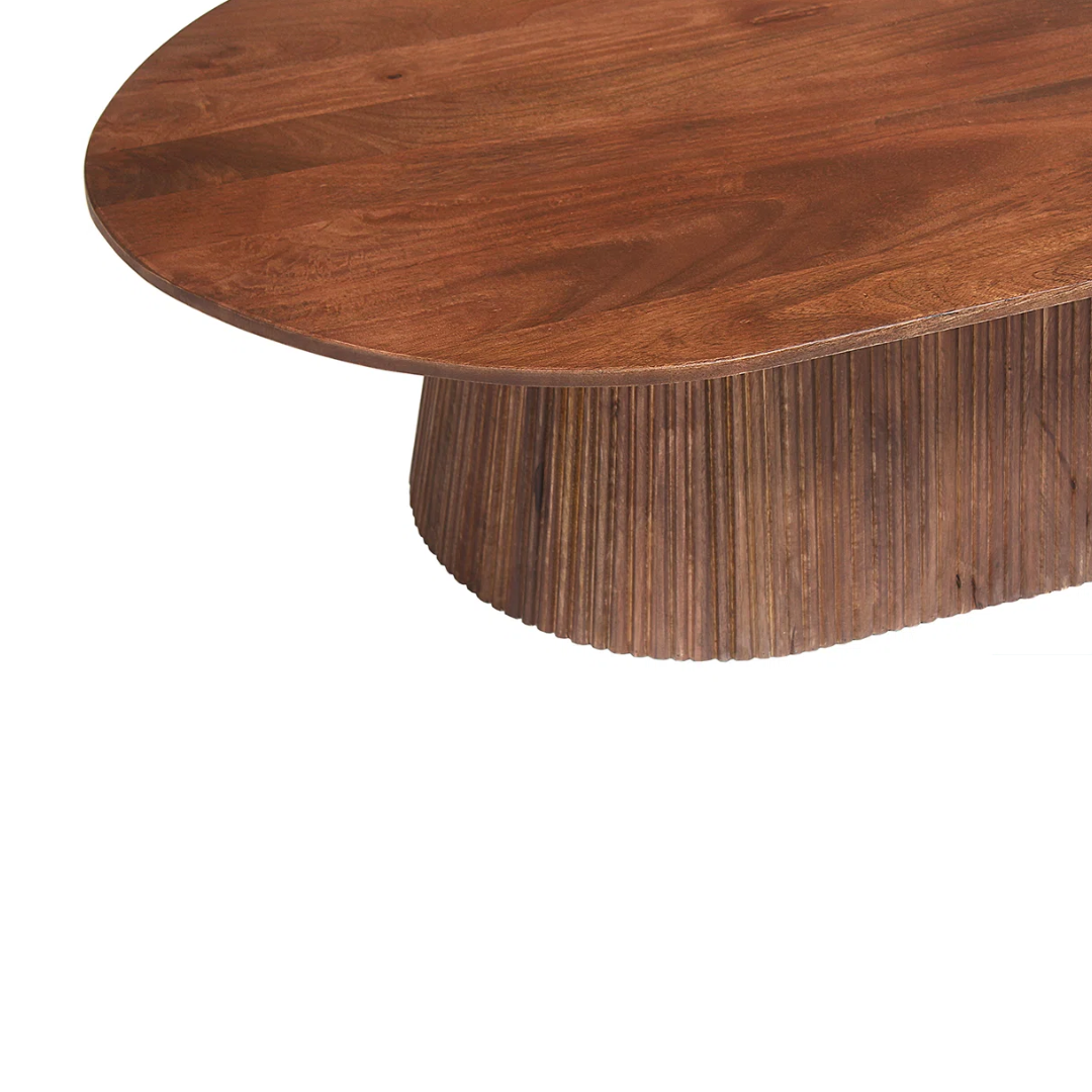 Wooden table with a unique base design on a white background