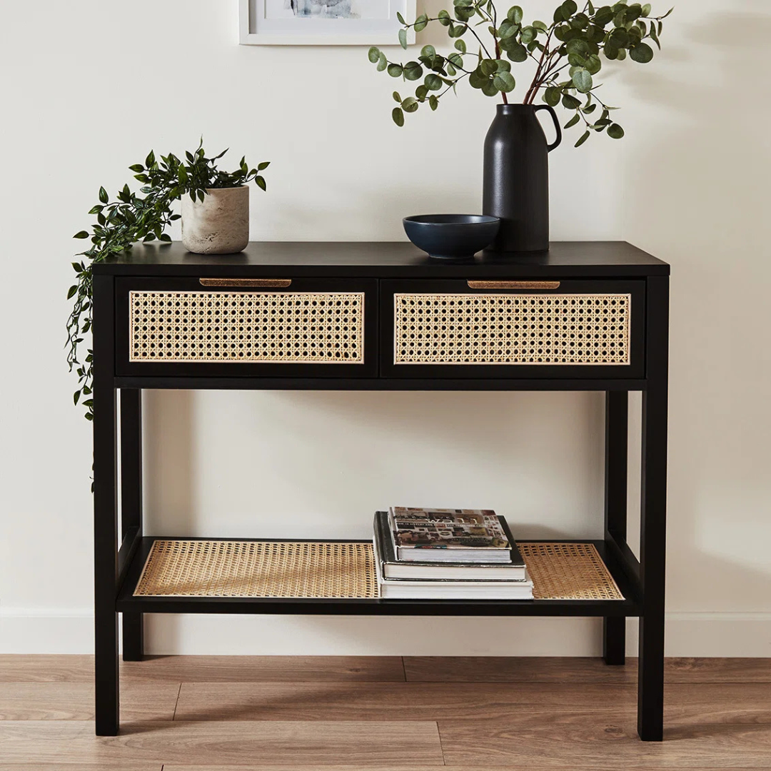 Rattan Black Wooden Console Table, front view in a model home.