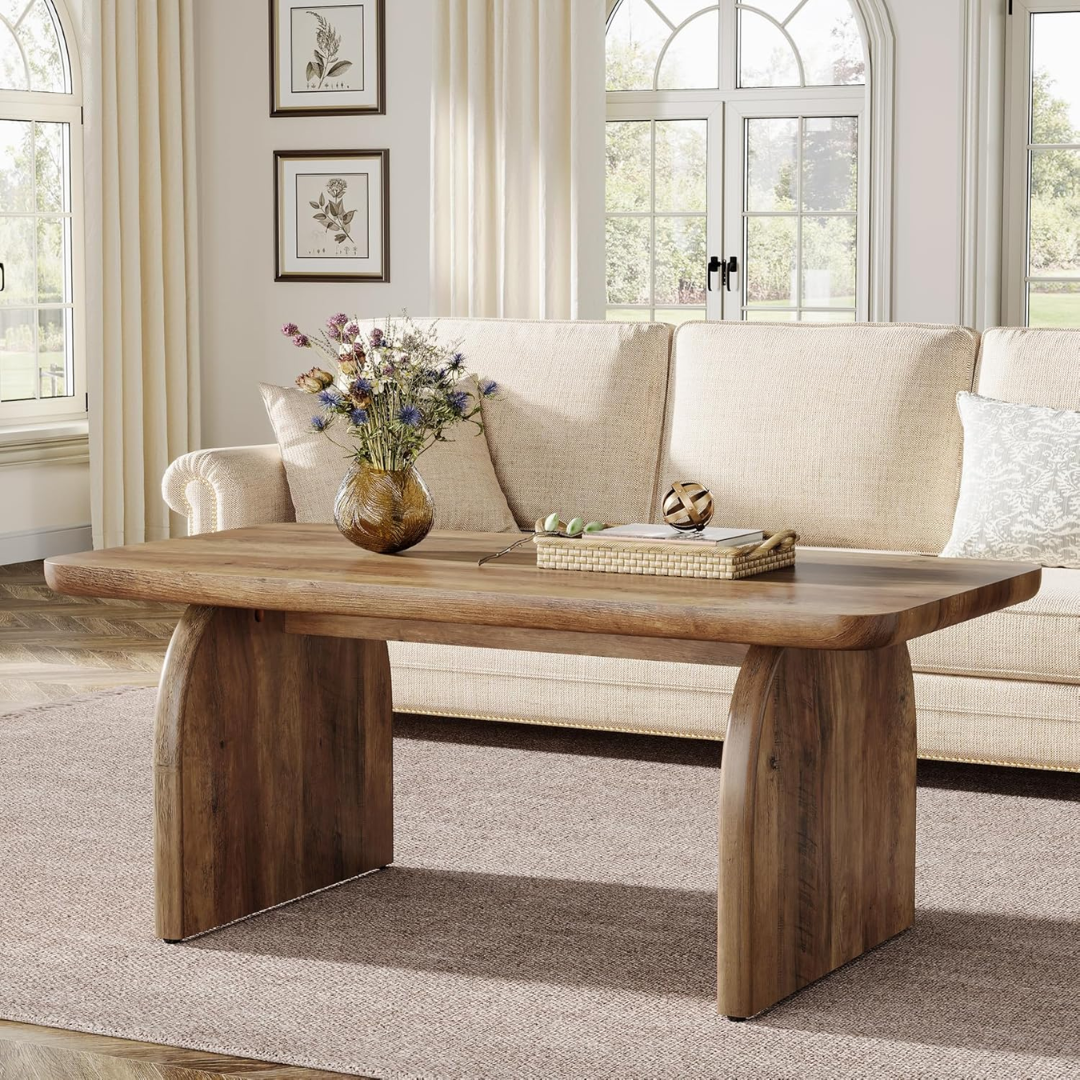 Wooden coffee table with decorative items in a living room setting
