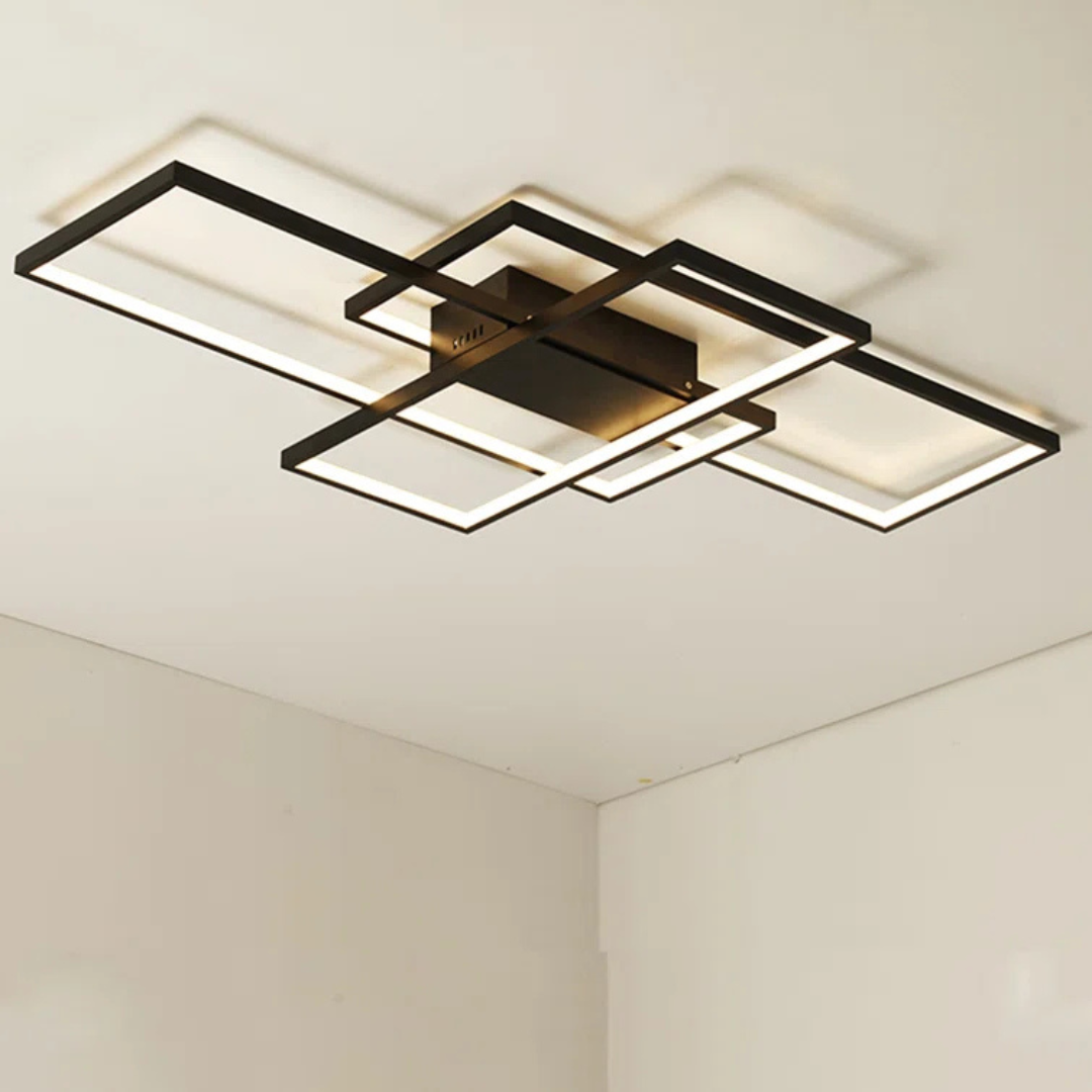 Modern ceiling light fixture with black frame and square design on a white ceiling.