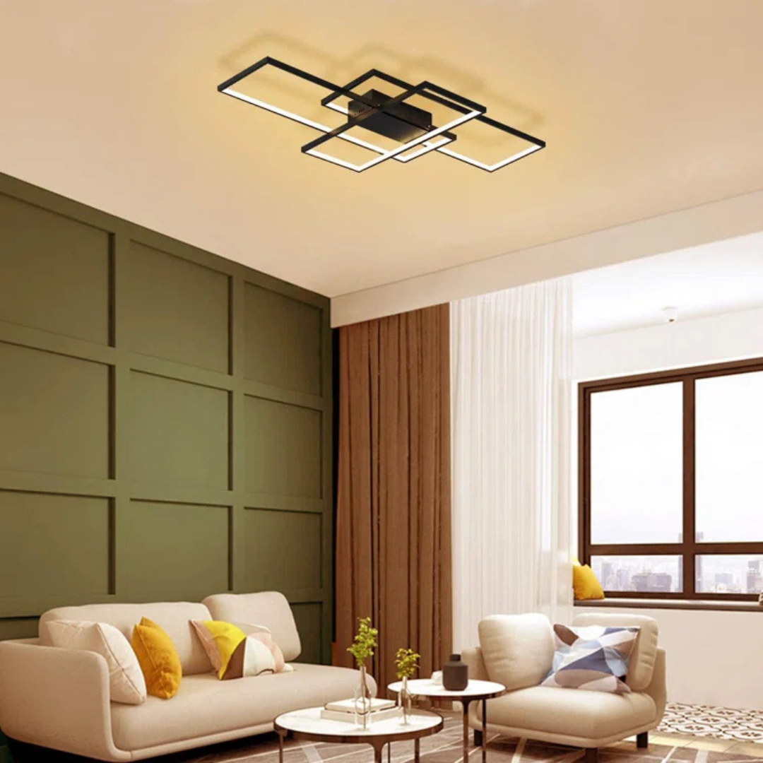 Modern living room with a ceiling light fixture, sofa, and window.