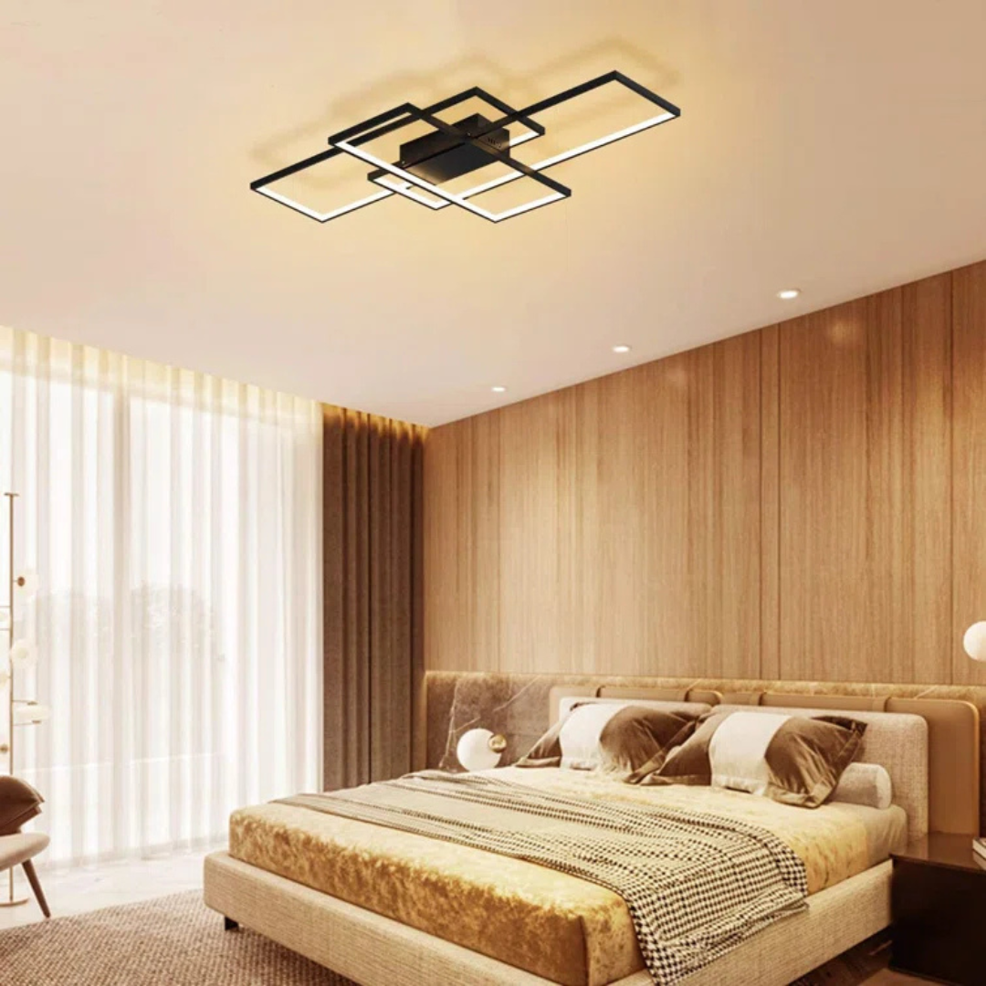Modern bedroom with a ceiling light fixture, bed, and wooden wall.
