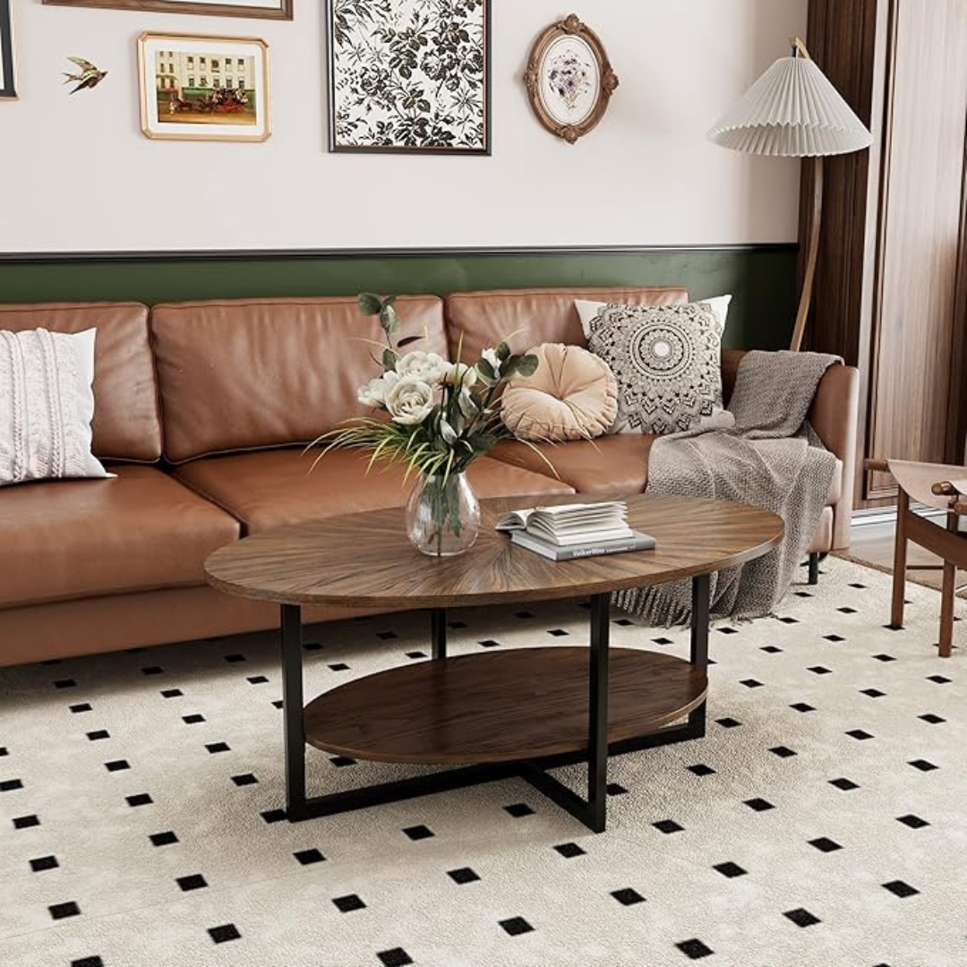Rustic brown oval coffee table with lower shelf, set up in a rustic home.