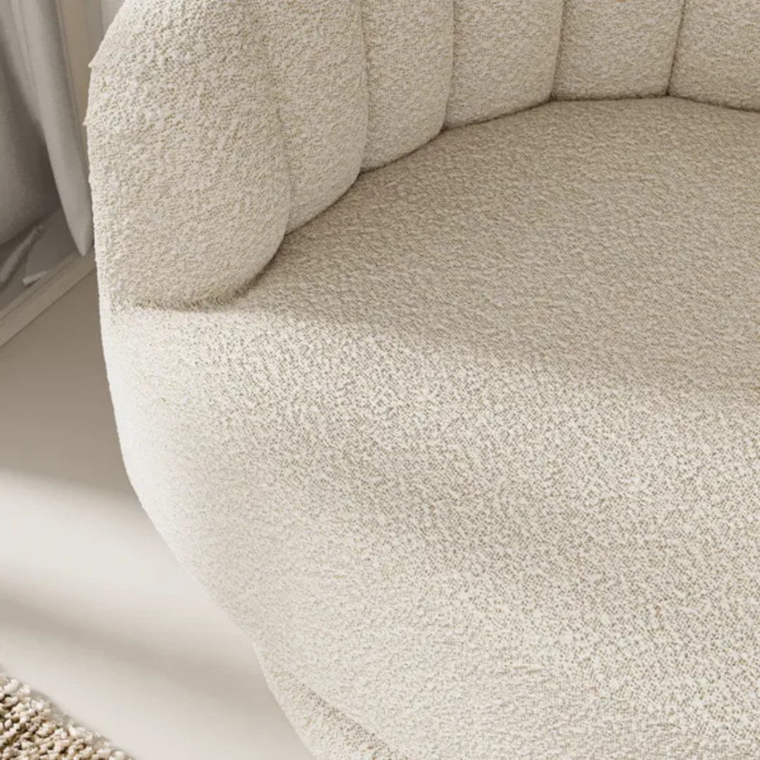 scalloped bouclé swivel chair with fluted backrest design, close up to boucle fabric