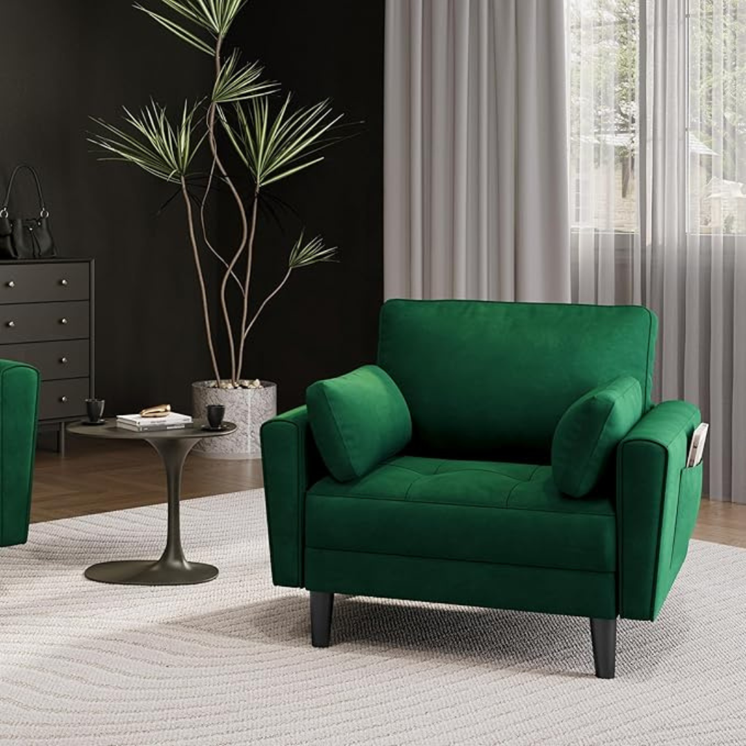 velvet emerald green armchair with matching cushions, set in the corner of a modern living room.
