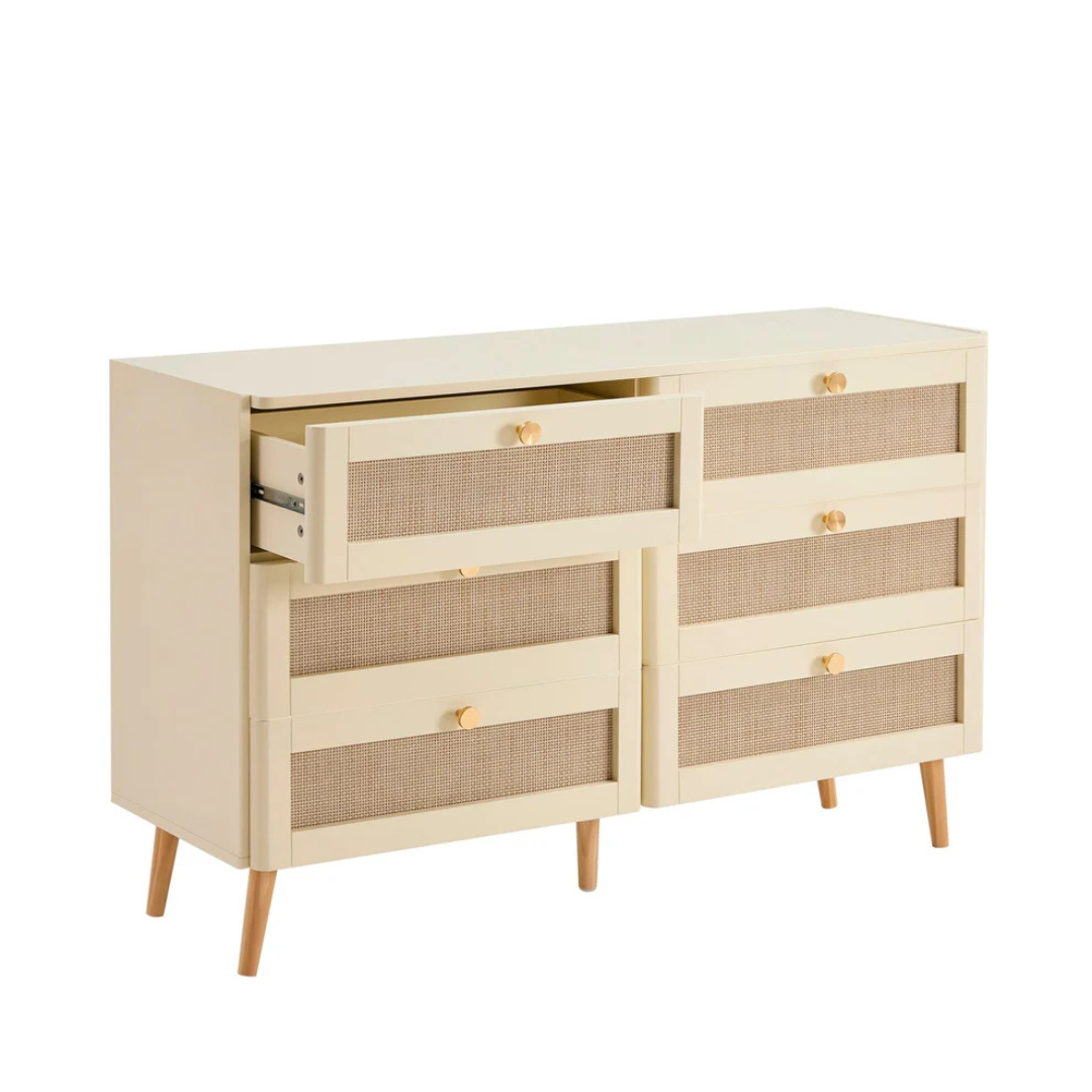 Beige dresser with wicker drawers on a white background