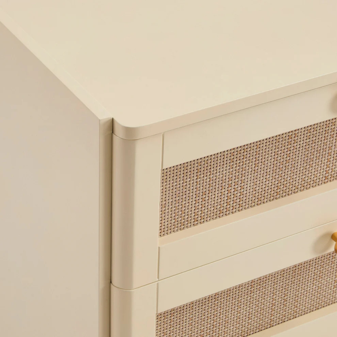 Close-up of a corner with beige wall and ceiling, featuring a textured panel.