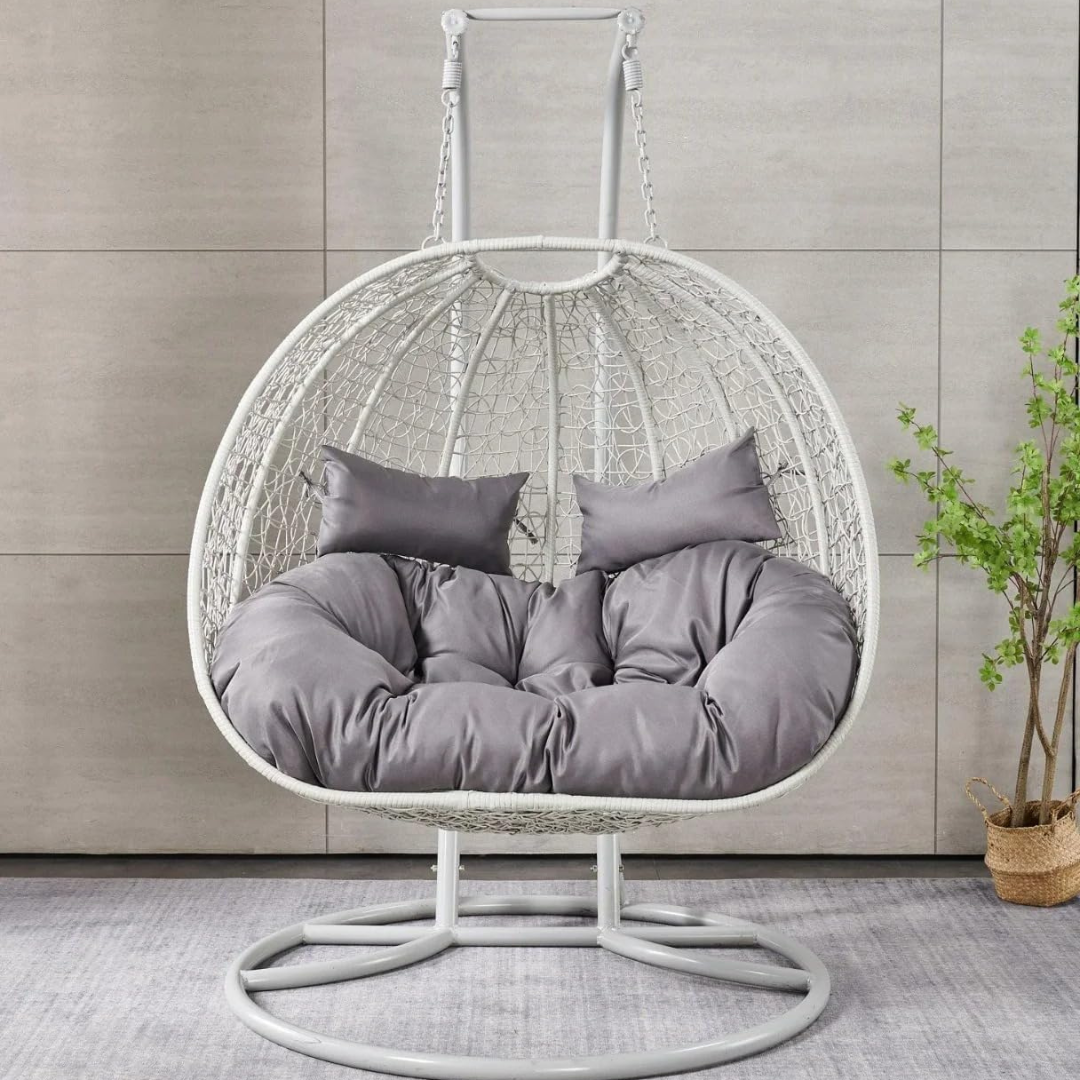 White Double Hanging Egg Chair, front view, in a modern model home.
