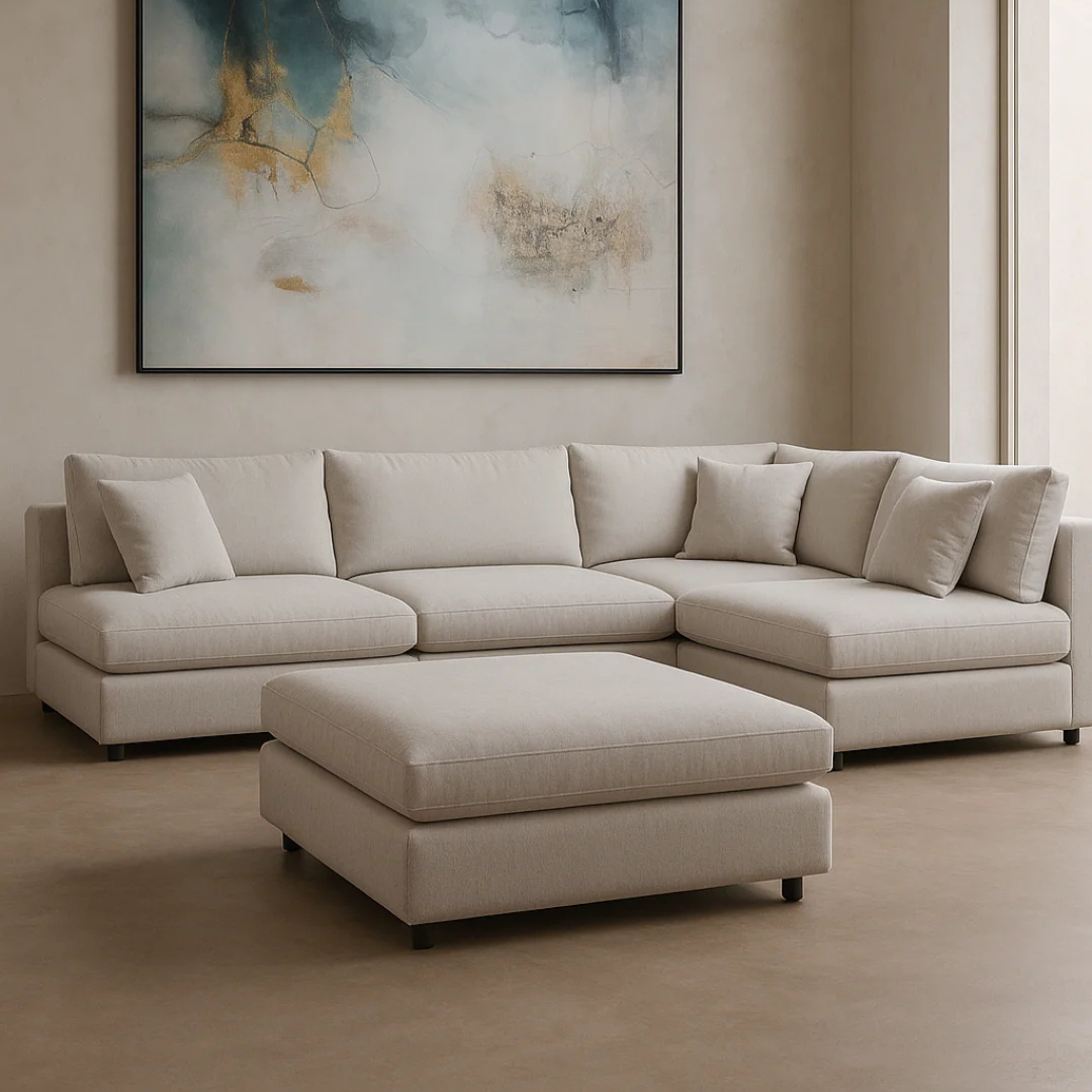 image shows a contemporary corner sofa set in a model home, with beige walls and art decor.