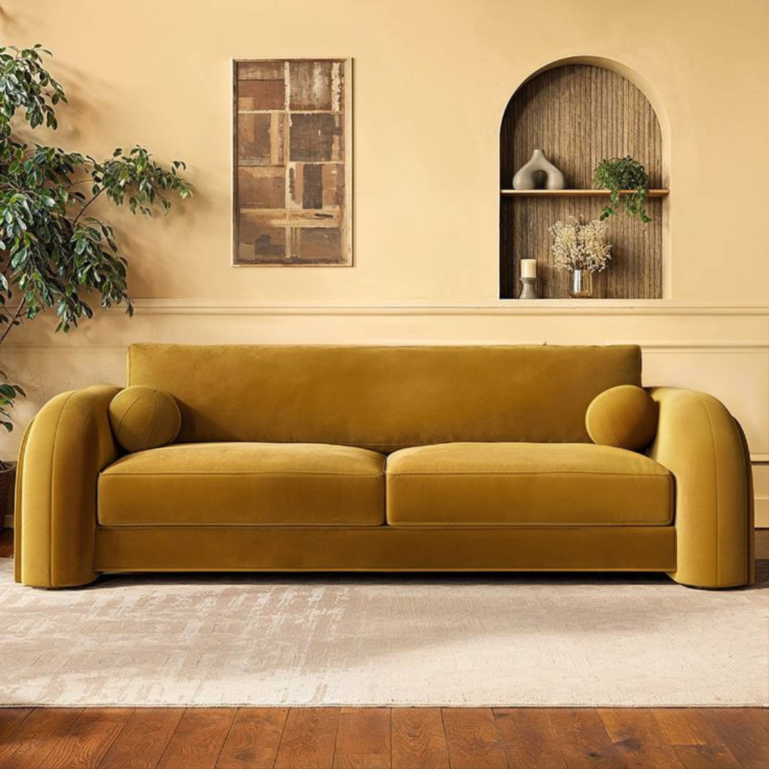 image shows a retro yellow 3 seater sofa set in a modern home.