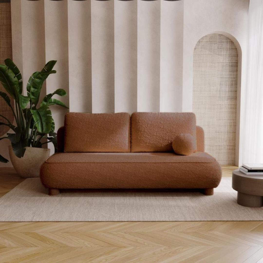 This image shows a brown retro sofa bed set in a modern home.