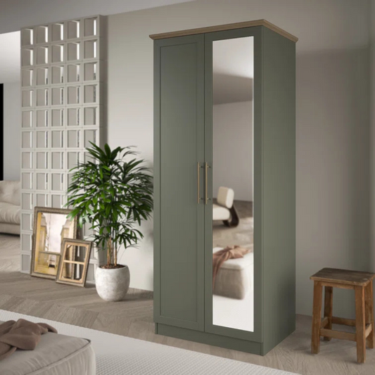 Sage Green wardrobe with mirror in a room setting with decor elements.