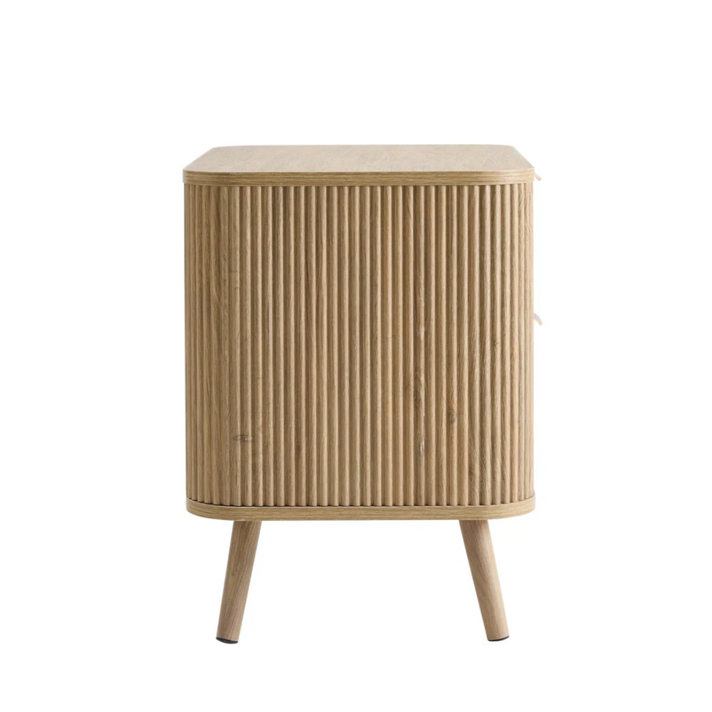 Wooden side table with a ribbed design on a white background