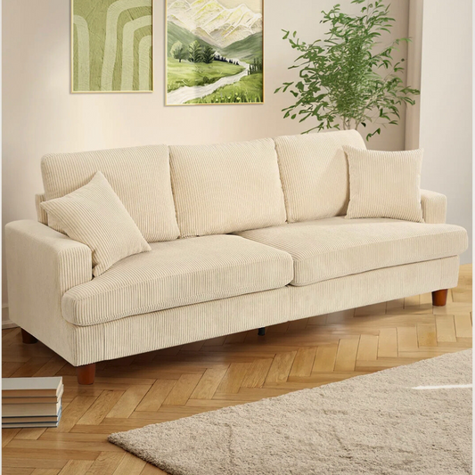 3-Seater Beige Corduroy Fabric Sofa, set in a model home.