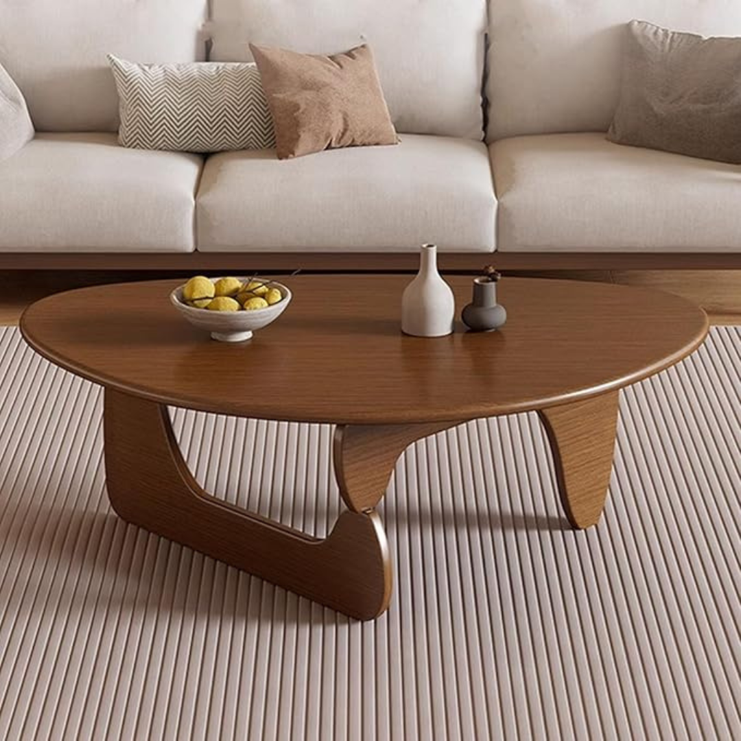 abstract mid century coffee table with sculptural wood base, set in a mid century living room.