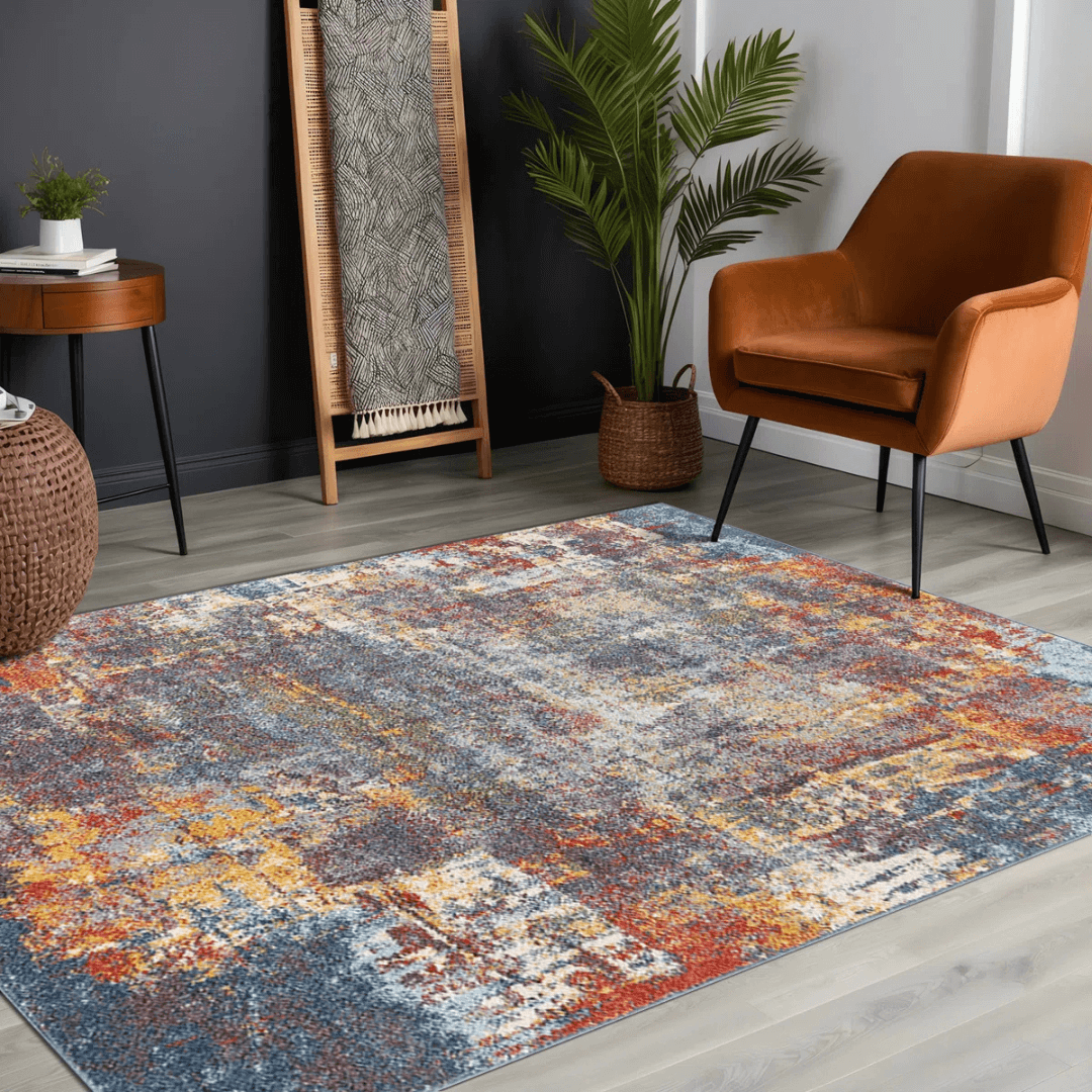 Multicolored area rug in a room with a brown chair, plant, and wooden side table.