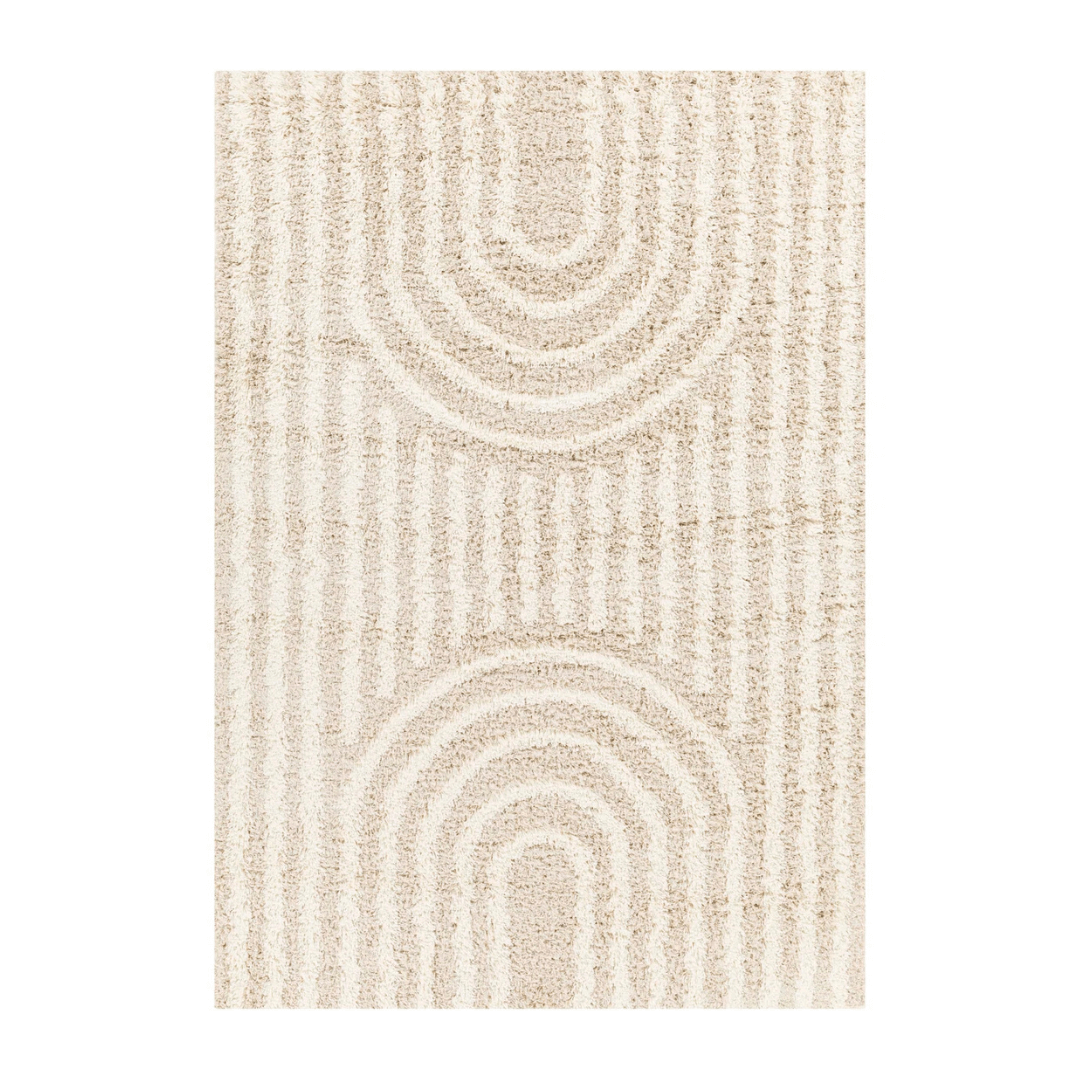 Beige area rug with circular pattern on a white background