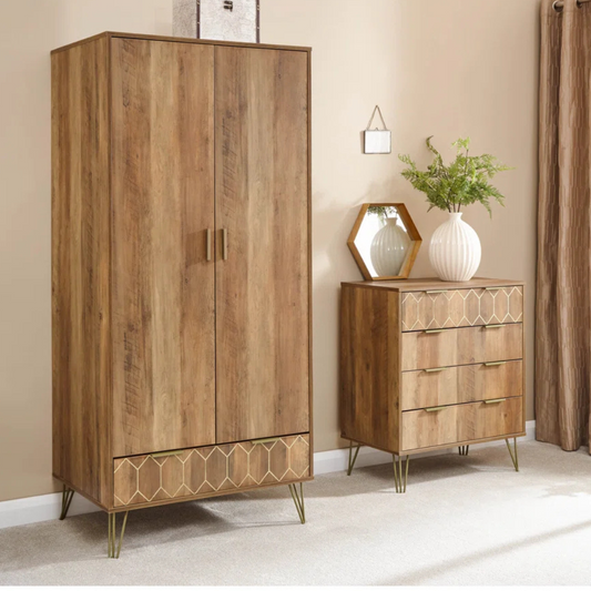 Wooden wardrobe and chest of drawers in a room with beige walls and curtains.