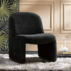 black boucle funky accent chair with curved design, in a modern reading room.