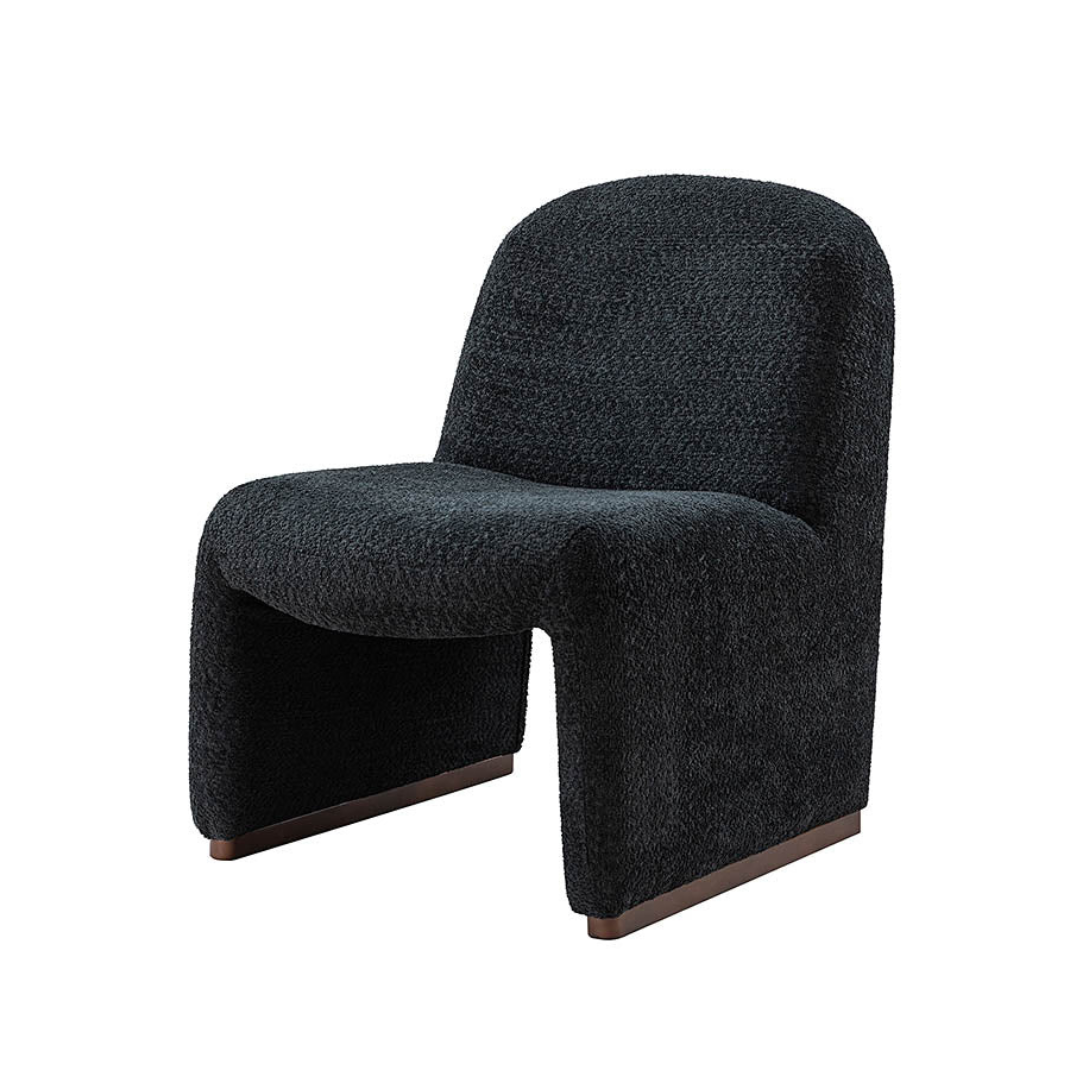 black boucle funky accent chair with curved design, angled view, white background.