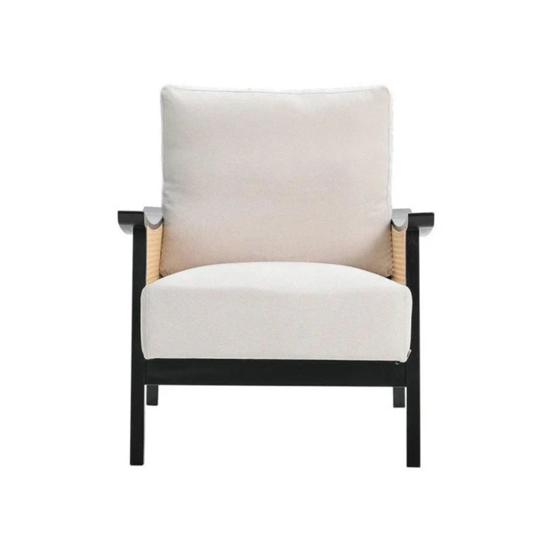 black indoor rattan armchair with curved open weave design, white background, front view.